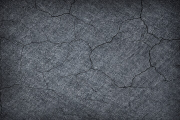 Dark grey black slate stone crack background or texture.