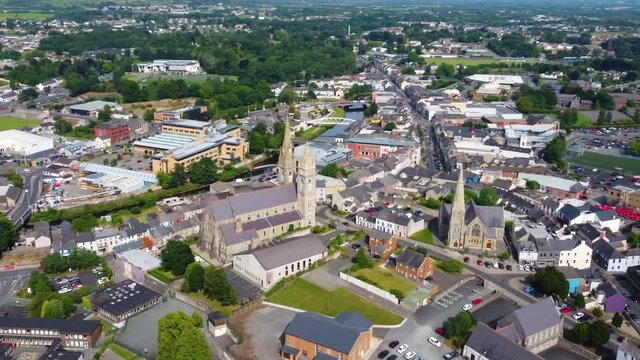 Aerial video of St Columbas Church of Ireland Sacred Heart Church in Omagh Town Centre Co Tyrone Northern Ireland 