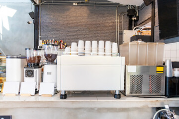 Blank mock up of minimal coffee bar and counter compose of coffee machine, coffee grinding machine...