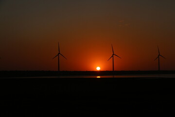 wind turbine at sunset