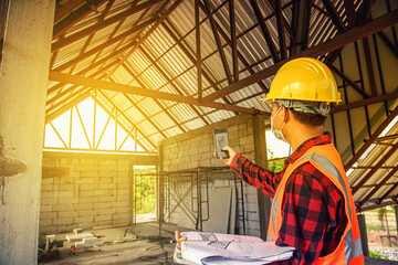 Worker man with safety helmet Construction building industry, new home, construction interior service concepts - Selective focus..vintage film grain filter effect styles