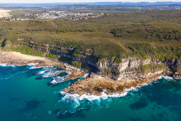 Aerial view of the rugged cliff and coastline in the Awabakal Nature reserve located between...