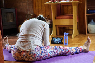 woman doing yoga in quarantine 