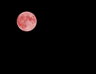 red full moon and black sky at midnight