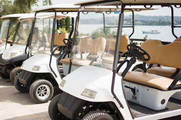 white golf cars in a cart. electric car 