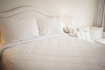 big white bed with pillows