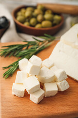 Delicious pieces of feta cheese on board
