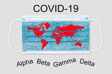 Face mask with world map and inscription COVID 19 Alpha Beta Gamma Delta . Covid 19 variants outbreak around the world