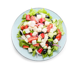 Plate with fresh Greek salad on white background