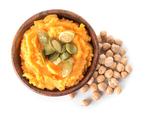 Bowl with tasty carrot hummus and chickpeas on white background
