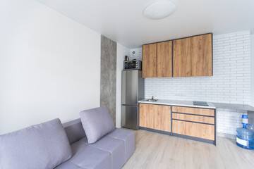 Small kitchenette in a studio, interior lighting.