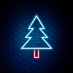 Glowing neon line Christmas tree icon isolated on brick wall background. Merry Christmas and Happy New Year. Colorful outline concept. Vector