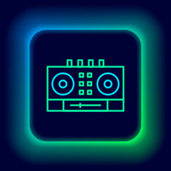 Glowing neon line DJ remote for playing and mixing music icon isolated on black background. DJ mixer complete with vinyl player and remote control. Colorful outline concept. Vector