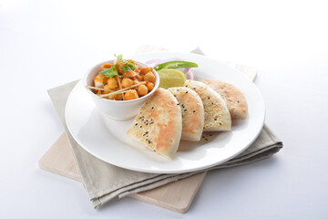 Indian vegetable bean curry with baked naan pizza bread in white background vegan dim sum Halal menu