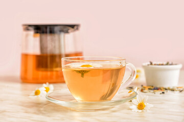 Cup of floral tea on table