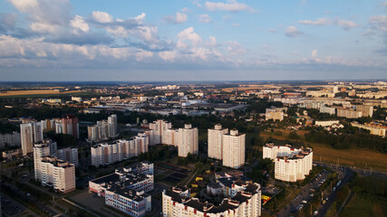 Fototapeta na wymiar City block. Multi-storey buildings. City landscape at sunrise. Aerial photography.