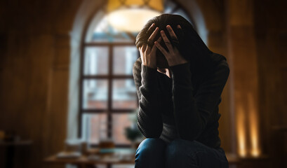Fototapeta premium woman sit Depression Standing by window