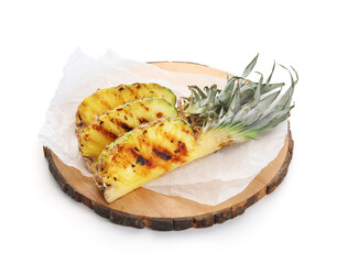 Board with grilled pineapple slices on white background
