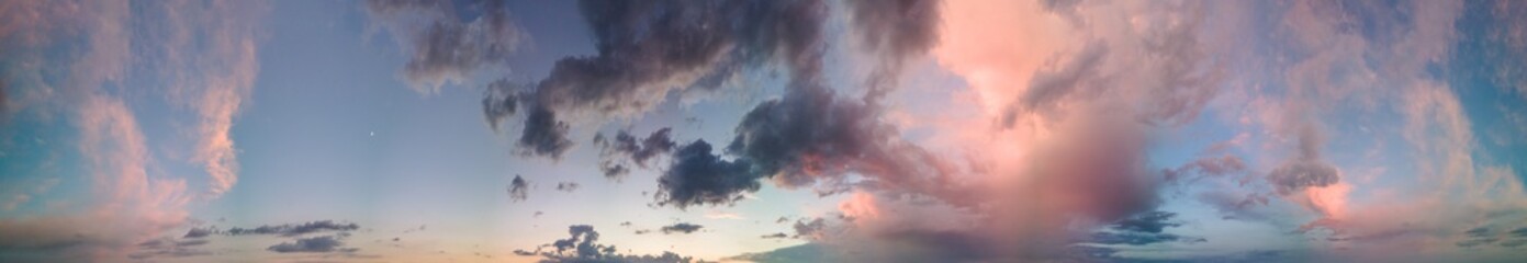 Sunset sky from the drone, blue and red shapes, panoramic view.