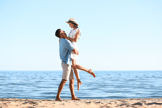 Happy young couple on sea beach