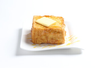 thick egg french toast with butter and honey in white background snack halal menu