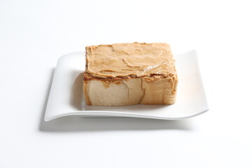 thick peanut butter toast in white background snack halal menu