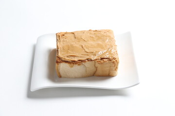 thick peanut butter toast in white background snack halal menu