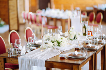 Wedding. Banquet. Luxury rich table setting for a wedding celebration, party in nice cozy restaurant. 