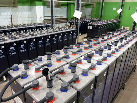 Rows of industrial storage batteries.A room used for backup or uninterruptible power supply.