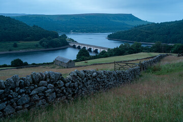 Ladybower Reservoir, Peak District UK: A close up of a hillside next to a body of water