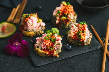 Sushi. Sushi with surimi. Decorated sushi with surimi, wasabi and ginger. 