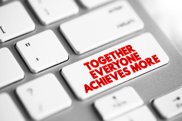 Together Everyone Achieves More text button on keyboard, concept background