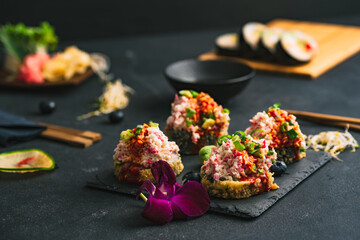 Sushi. Sushi with surimi. Decorated sushi with surimi, wasabi and ginger.  - obrazy, fototapety, plakaty