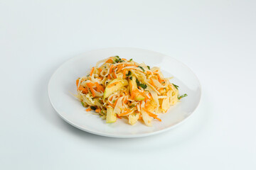 cabbage salad with apple and carrot isolated on white. fresh vitamin salad in plate