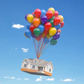 House with balloons bunch flying in the sky. Real estate purchasing, moving house and housewarming concept.