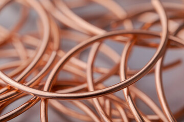 Copper wire non-ferrous metals, product metalworking industry. Abstract metal shapes.
