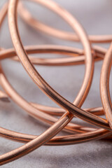 Copper wire non-ferrous metals, product metalworking industry. Abstract metal shapes.