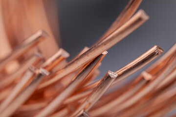 Copper wire non-ferrous metals, product metalworking industry. Abstract metal shapes.