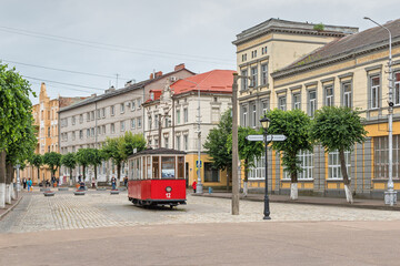 Sovetsk, Kaliningrad Region, Russia. Victory Street - a pedestrian zone in the city center. Monument to the tram - 447067552