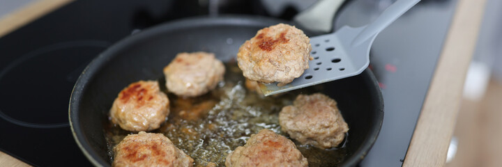Turn cutlets in frying pan with spatula