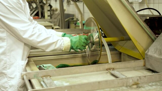 Vinyl record factory: Lacquer is dipped into a nickle bath, where an electro charge fuses the nickle to the silver.