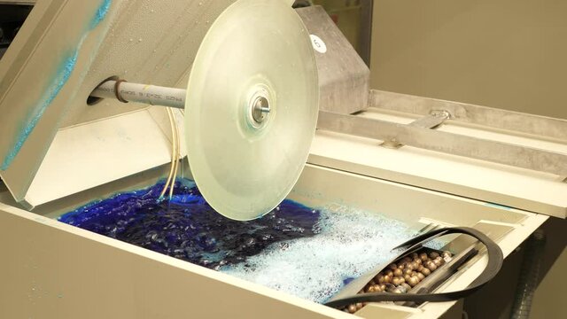 Vinyl record factory: Lacquer is dipped into a nickle bath, where an electro charge fuses the nickle to the silver.