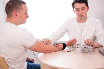 Patient nerves testing using electromyography at medical center