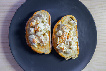 Egg salad on a slice of bread.