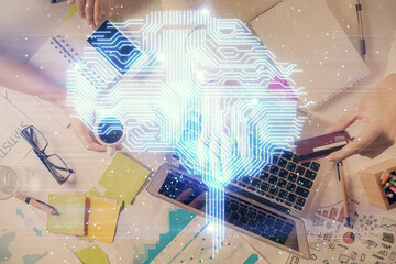 Double exposure of man's hands typing over computer keyboard and brain hologram drawing. Top view. Ai and data technology concept.