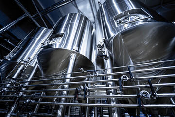 Rows of steel tanks for beer fermentation and maturation in a craft brewery