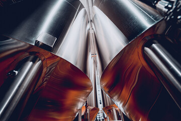 Rows of steel tanks for beer fermentation and maturation in a craft brewery