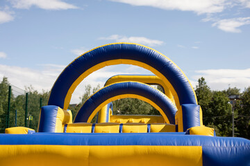Inflatable obstacle course for fun. Inflatable structure in the park.