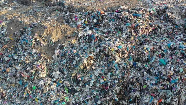 Aerial top drone view of large garbage pile, trash dump, landfill, waste from household dumping site, garbage background. Consumerism and contamination concept.