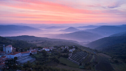 A Croatian village in a mountainous area in the first rays of the rising sun. The foot of the...